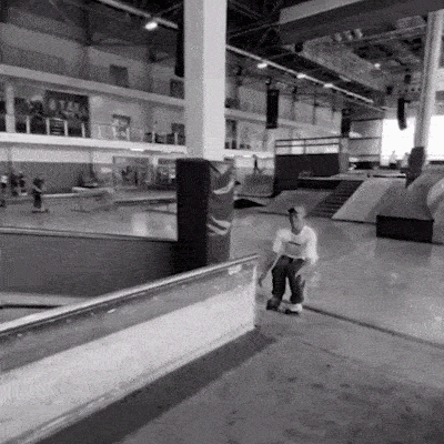 Ilia Savosin form jwax rollerblading team doing a fast slide on a big funbox at a skatepark